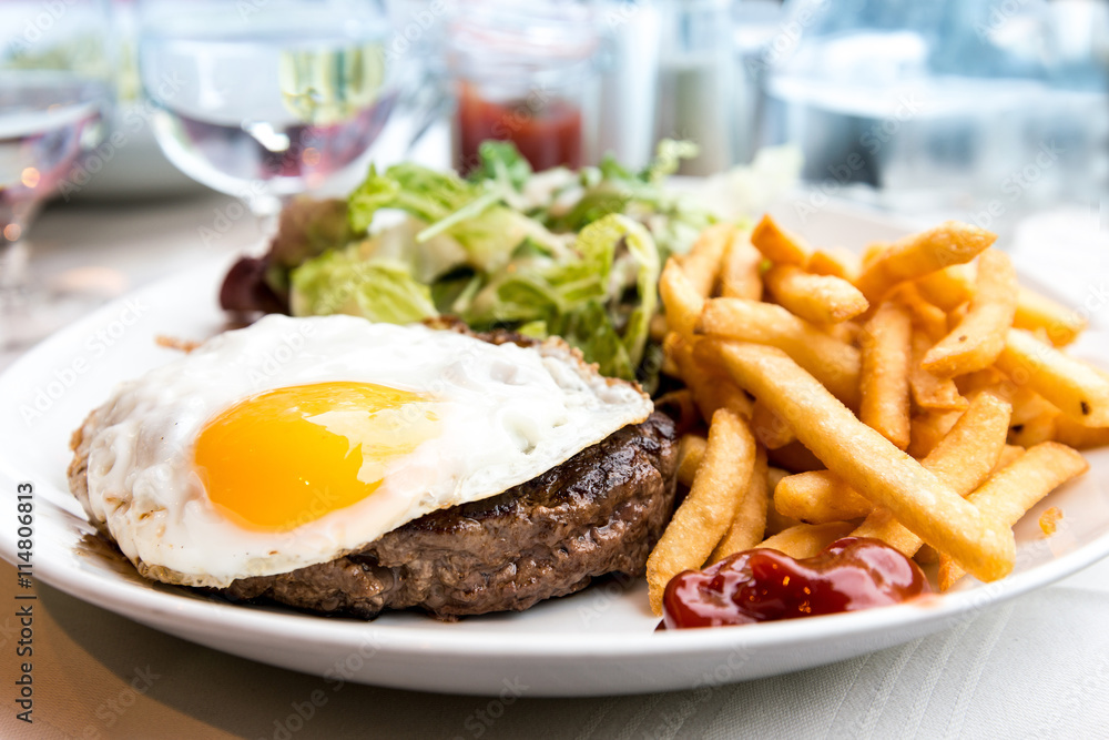 Egg and fries - classical english breakfast with egg and fries Egg and fries - classical english breakfast with egg and fries