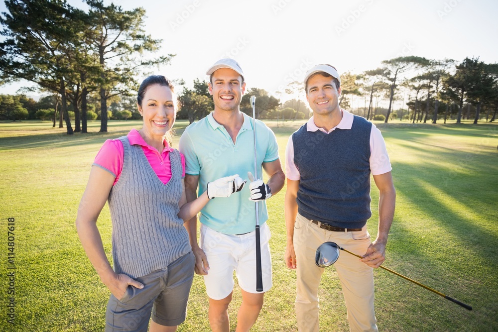 Portrait of smiling golfer friends Portrait of smiling golfer friends