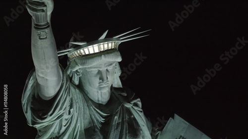 Close flight near Statue of Liberty at night