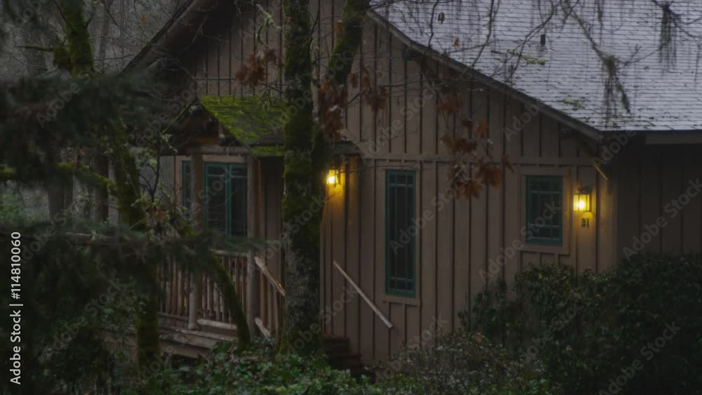 Zoom-in on guest cabin with trees in foreground at a resort near Grants Pass, Oregon Zoom-in on guest cabin with trees in foreground at a resort near Grants Pass, Oregon
