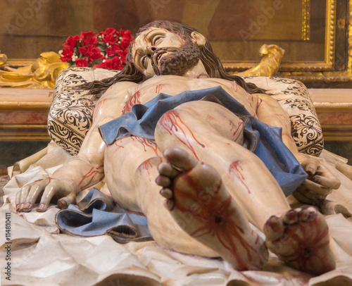 SEGOVIA, SPAIN, APRIL - 14, 2016: The carved statue of death Christ in the tomb "Cristo Yacente" by Gregorio Fernandez (1631 - 1636) in cathedral of Our Lady of Assumption.