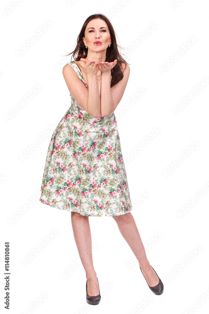 Air kiss. Adult woman posing in bright summer dress, isolated on Air kiss. Adult woman posing in bright summer dress, isolated on