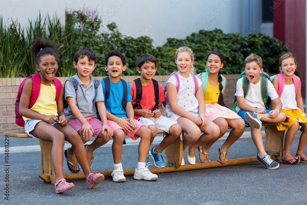 Smiling schoolchildren on seat