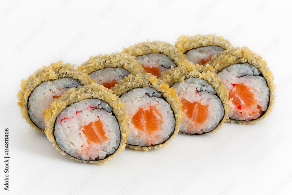 Warm rolls of sushi with salmon on white background Warm rolls of sushi with salmon on white background