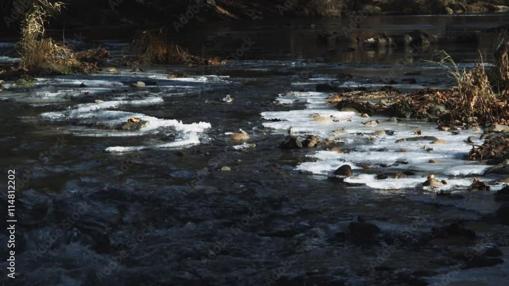 Rapids on a partially frozen forest stream Rapids on a partially frozen forest stream