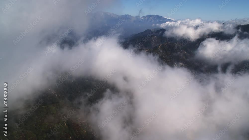 Flying through clouds over the Angeles National Forest in the rugged San Gabriel Mountains, California. Shot in 2010. Flying through clouds over the Angeles National Forest in the rugged San Gabriel Mountains, California. Shot in 2010.
