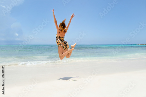 girl jumping at the beach