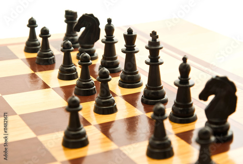 black chess figures on chessboard