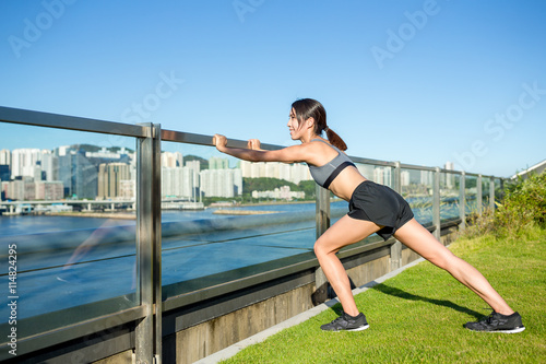 Woman doing warm up exercise at outdoor