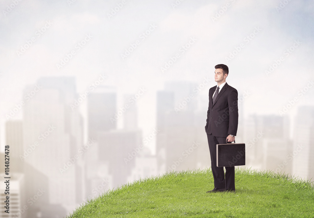 man standing in front of city landscape man standing in front of city landscape