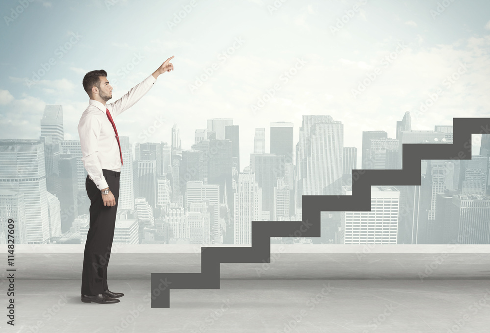 Business person in front of a staircase Business person in front of a staircase