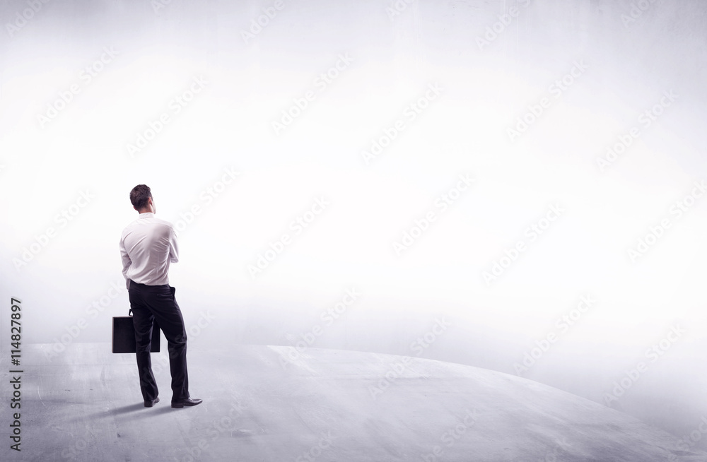 Business person standing from rear view Business person standing from rear view