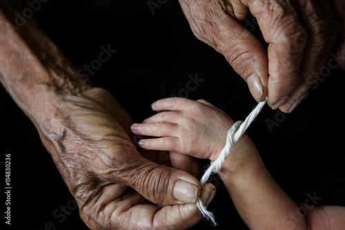 Grandma thread that tied the hands and pray, Lanna Thai Culture
