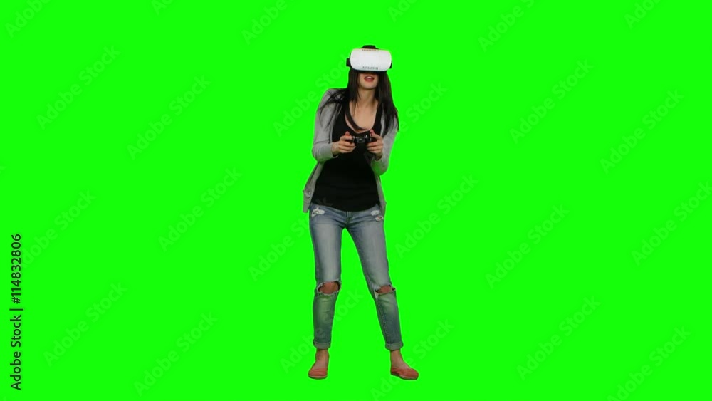 Surprised girl plays some virtual reality games. Green screen Surprised girl plays some virtual reality games. Green screen