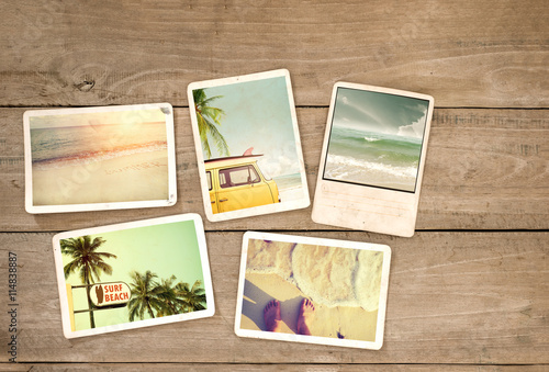 Photo album remembrance and nostalgia journey in summer surfing beach trip on wood table. instant photo of vintage camera - vintage and retro style