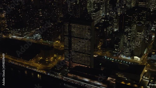 Above New York's East River at night, UN Building in foreground. Shot in November 2011.