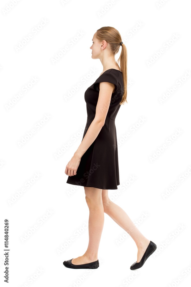 back view of walking woman in dress. back view of walking woman in dress.