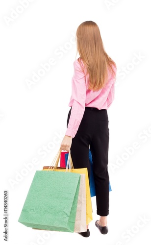 back view of woman with shopping bags .