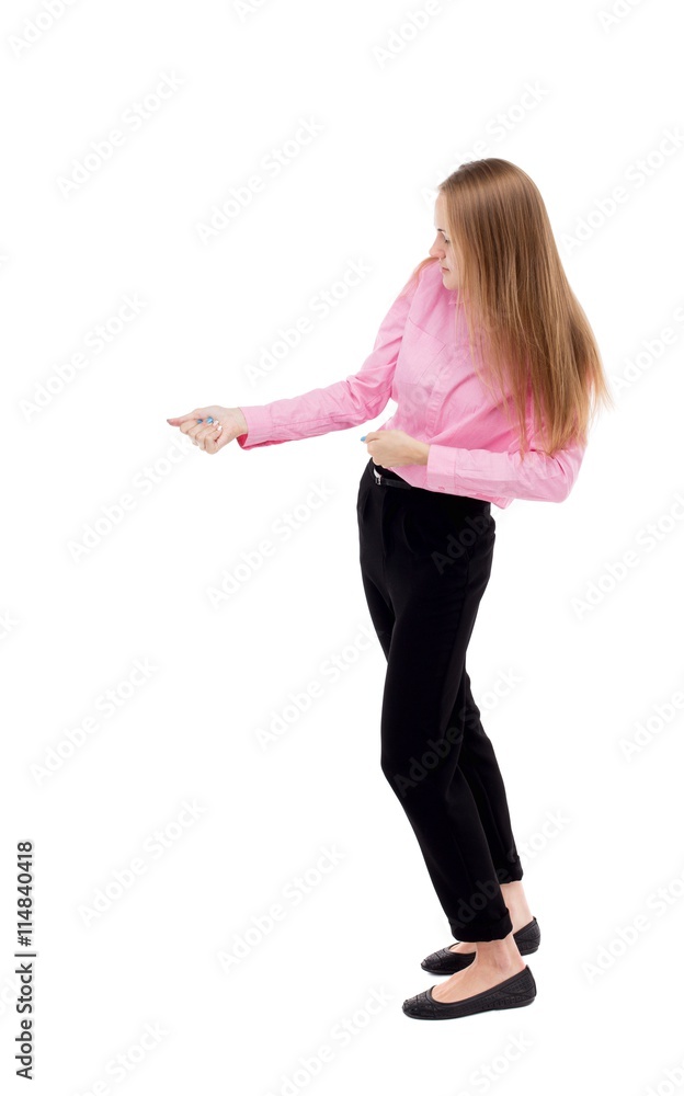 back view of standing business woman pulling a rope from the top back view of standing business woman pulling a rope from the top