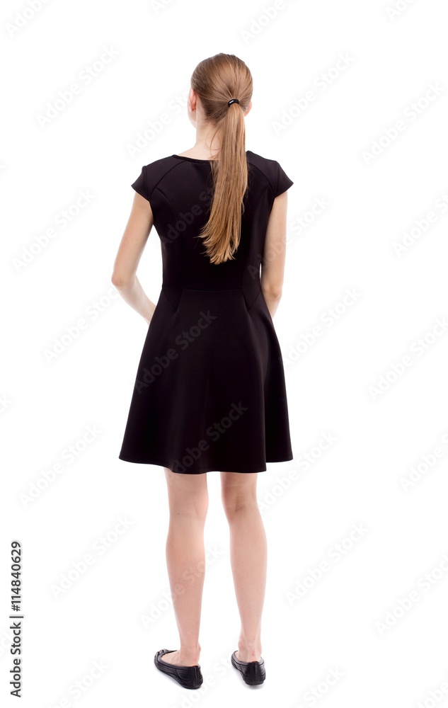back view of standing young beautiful  woman.