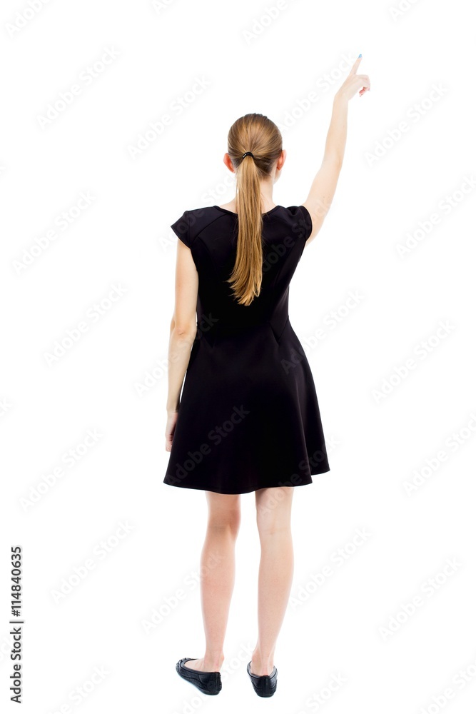 Back view of pointing woman. Back view of pointing woman.