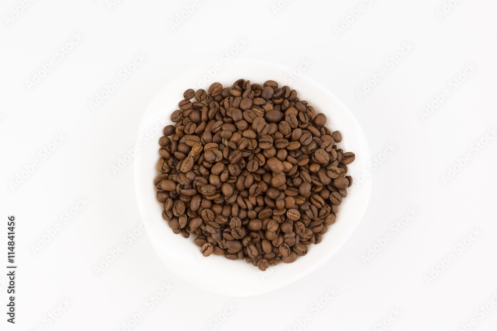 white plate full of coffee beans