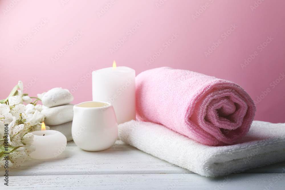 Spa treatment with blooming branch on wooden table Spa treatment with blooming branch on wooden table