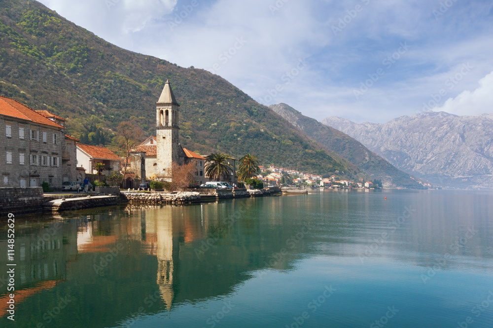 Seaside village Stoliv with Holy Name of Mary Catholic Church. Bay of Kotor, Montenegro