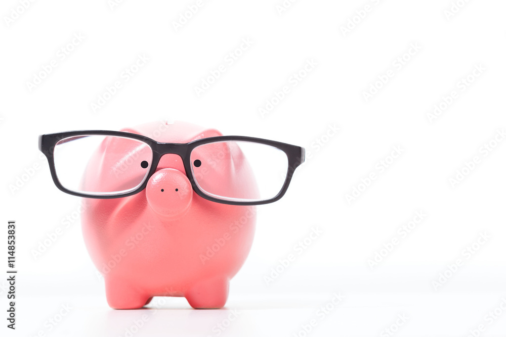 Pink piggy bank with glasses isolated on a white Pink piggy bank with glasses isolated on a white