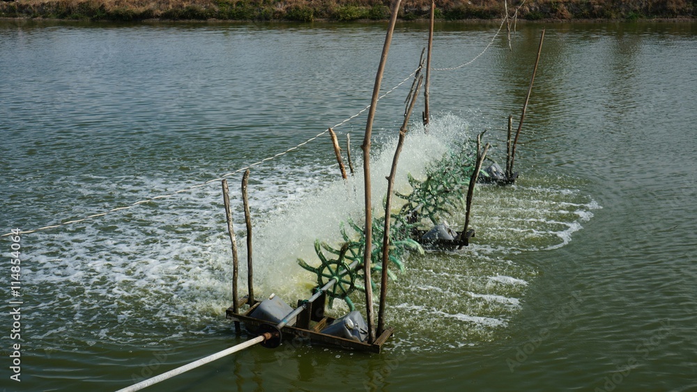 Fototapeta premium Aerator turbine wheel bring oxygen into water of lake