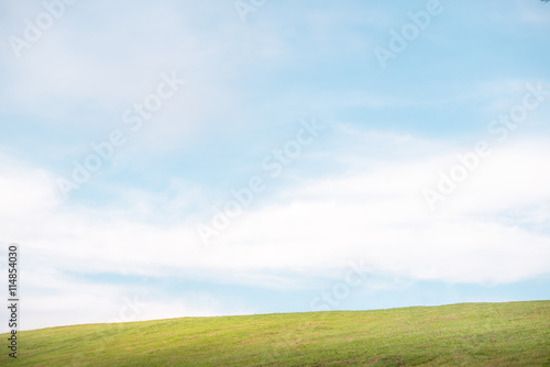 Green grass on the hills with clear blue sky