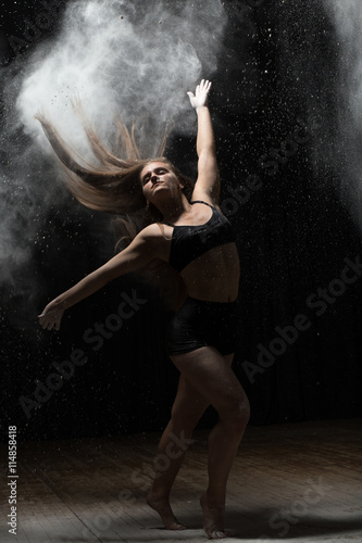 Girl dancing with a flour