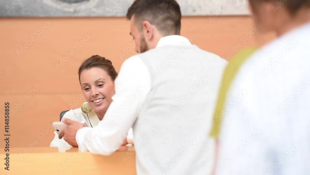 Man getting entrance ticket from e-reservation Man getting entrance ticket from e-reservation
