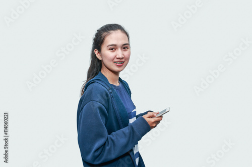 pretty female teenager asian using smartphone