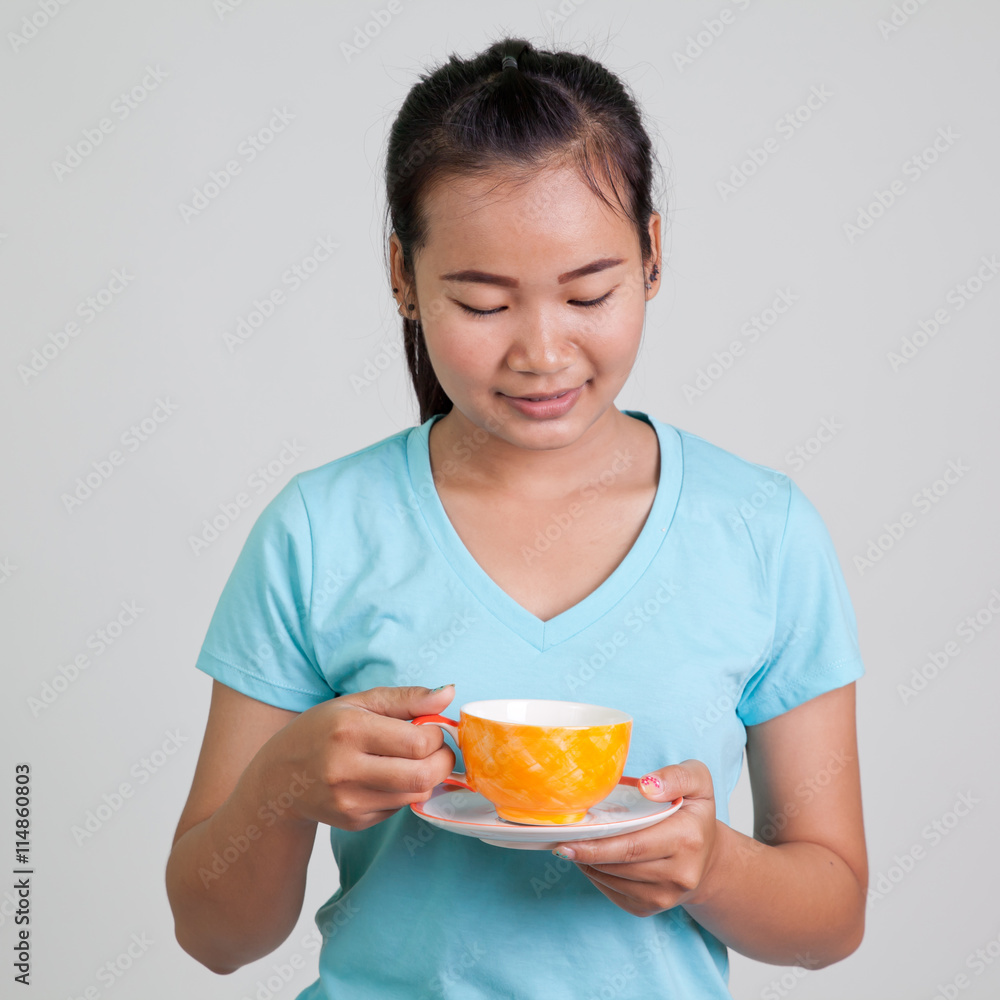 Asian woman drinking hot coffee
Asian woman drinking hot coffee