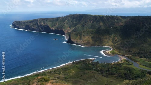 Over hilltop to orbit a cove on Molokai. Shot in 2010.