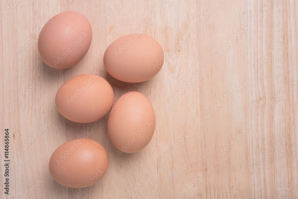 Fresh eggs ingredient on a wooden table rustic background. Fresh eggs ingredient on a wooden table rustic background.