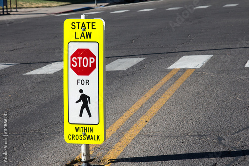 State law Stop for Pedestrians sign in the middle of the road © karagrubis