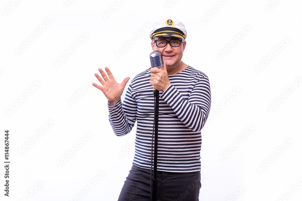Male sailor singer on microphone on white back Male sailor singer on microphone on white back