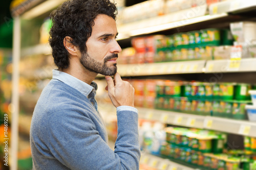 Attractive man shopping in a supermarket