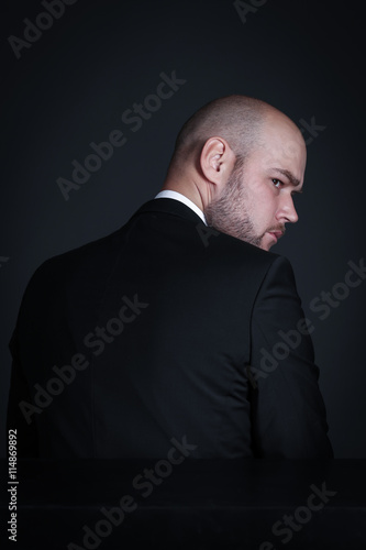 Portrait pensive stylish and brutal bald man with a beard