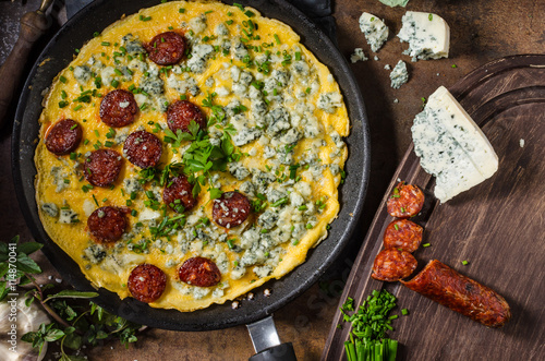 Omelet with blue cheese and sausage photo