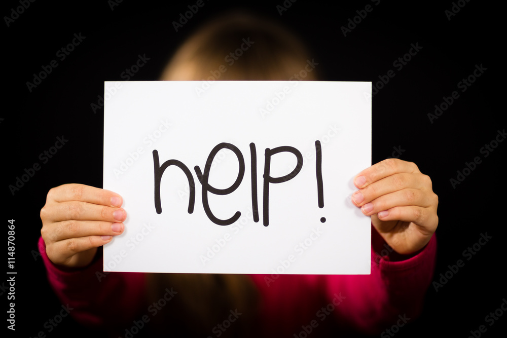 Child holding Help sign Child holding Help sign