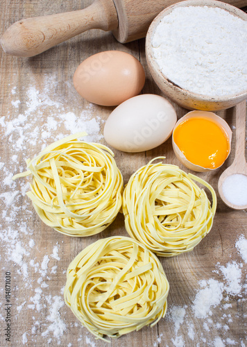 Raw homemade pasta and ingredients for pasta.