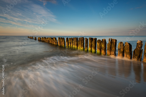 A breakwater on a sandy beach in Wladyslawowo, Poland, Europe. Baltic sea.