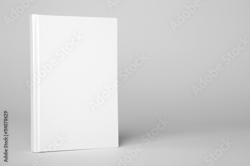 Real hardcover white book on a gray background photo