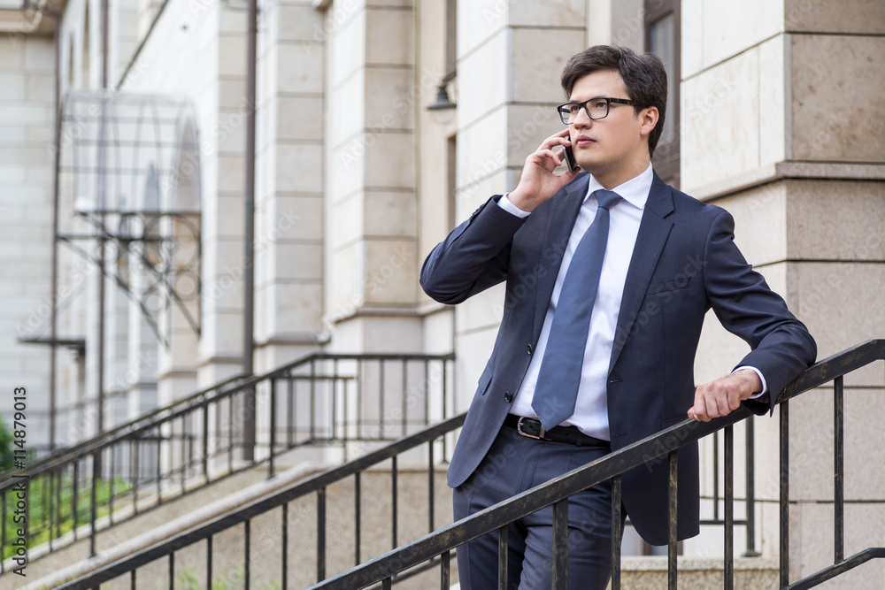Young businessman on phone Young businessman on phone