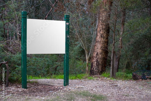 A blank sign along a hiking trail - includes clipping path for your artwork