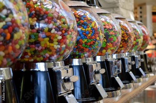 Candy Dispensers / Colorful candy dispensers on display.