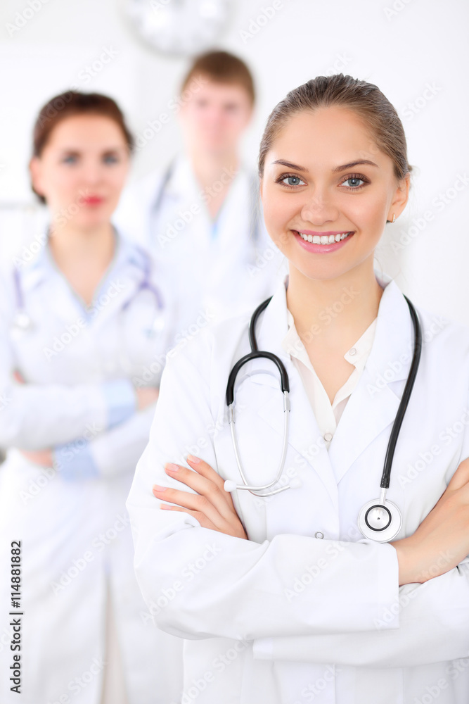 Happy doctor woman with medical staff at the hospital Happy doctor woman with medical staff at the hospital